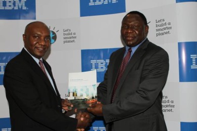 Tony Mwai IBM CGM and Dr. Bitange Ndemo PS ministry Of information presenting the white paper at the event.