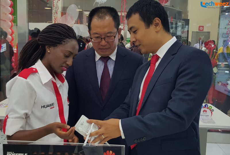 Huawei Kenya CEO Dean Yu and the Chinese Embassy Consular are take a look at the Huawei Mate S shortly after opening the Huawei brand store at Garden City Mall, Nairobi