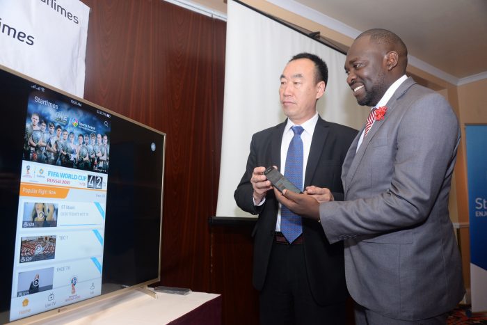 StarTimes Director of Marketing and PR Mr. Japhet Akhulia (right) is joined by the company’s Chief Executive Officer Mr. David Zhang (left) in demonstrating how the StarTimes mobile application works