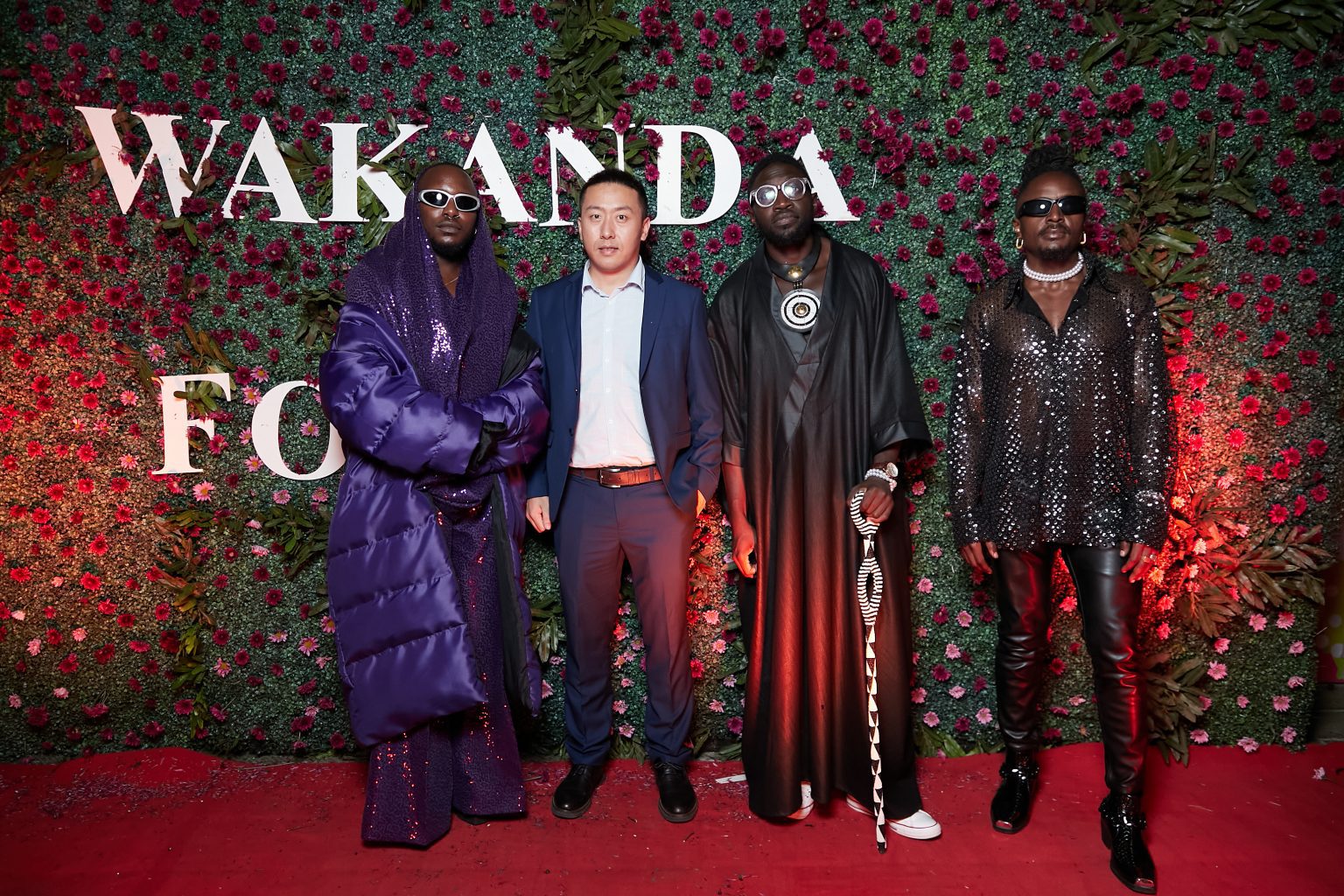 Sauti Sol band members next to Mike Zhang, Infinix Country Manager