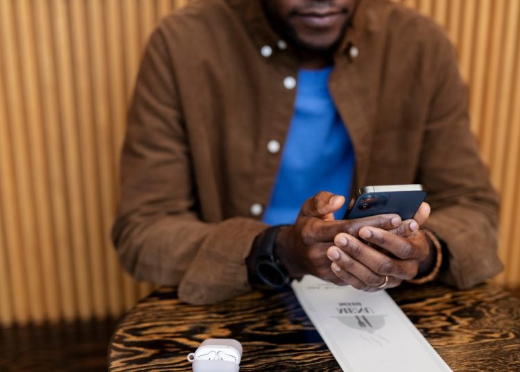 Man transacting on MPesa