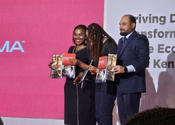 image of Dr. Margaret Nyambura Ndung’u, ICT CS and GSMA leaders holding the GSMA report at movenpick hotel