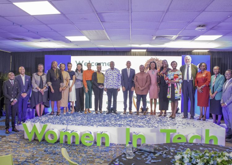 Mr. Kariuki Ngari, MD and CEO, of Standard Chartered Kenya and Africa (center), and Dr. Vincent Ogutu, Vice Chancellor of Strathmore University (center), pose with the top 7 winners of the Standard Chartered Women in Tech Cohort 7 program. Accompanying them are senior management members from Standard Chartered and Strathmore University.