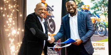 Official document handover by Bernard Mwonyonyo and Habib Lukaya from Roam.