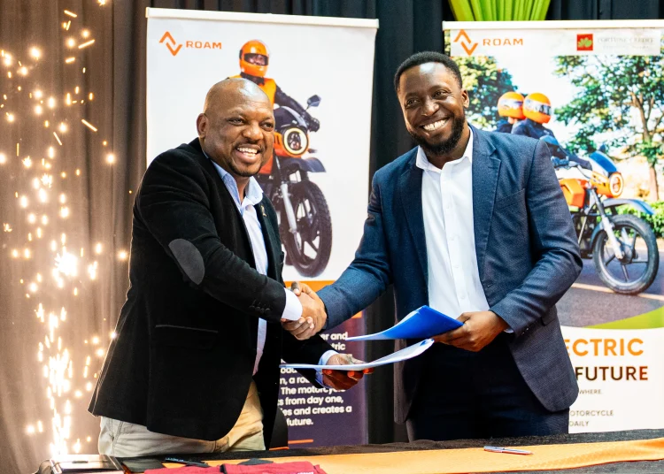 Official document handover by Bernard Mwonyonyo and Habib Lukaya from Roam.