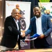 Official document handover by Bernard Mwonyonyo and Habib Lukaya from Roam.