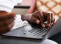 Close-up of a man shopping online from home