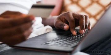 Close-up of a man shopping online from home