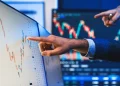 Stock traders pointing highest stock market