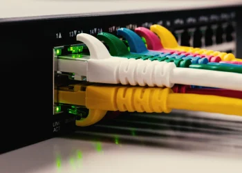 Close-up of multi-colored fiber cables connected to a server