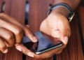User making a call on mobile phone