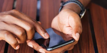 User making a call on mobile phone