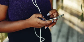 Woman typing on phone