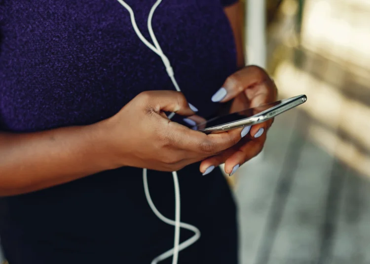 Woman typing on phone
