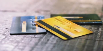 Several credit cards on wooden table