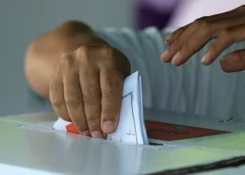 A voter casting a ballot on election day