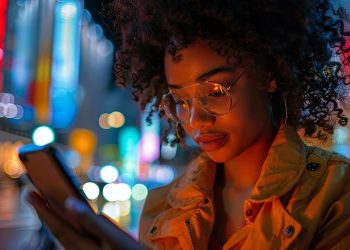 Woman using phone at night
