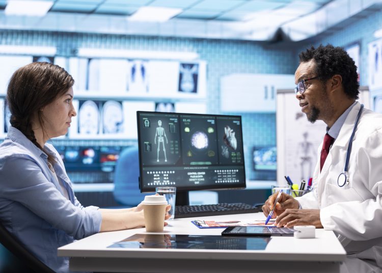 African american physician gives professional advice to woman patient, discussing about illness treatment and test results analysis. Doctor expert works in healthcare industry.